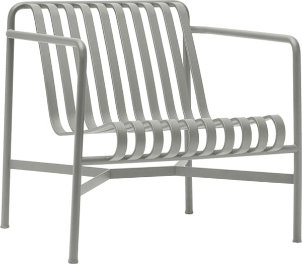 A three quarter view of a Palissade Lounge Chair, Low in light grey.